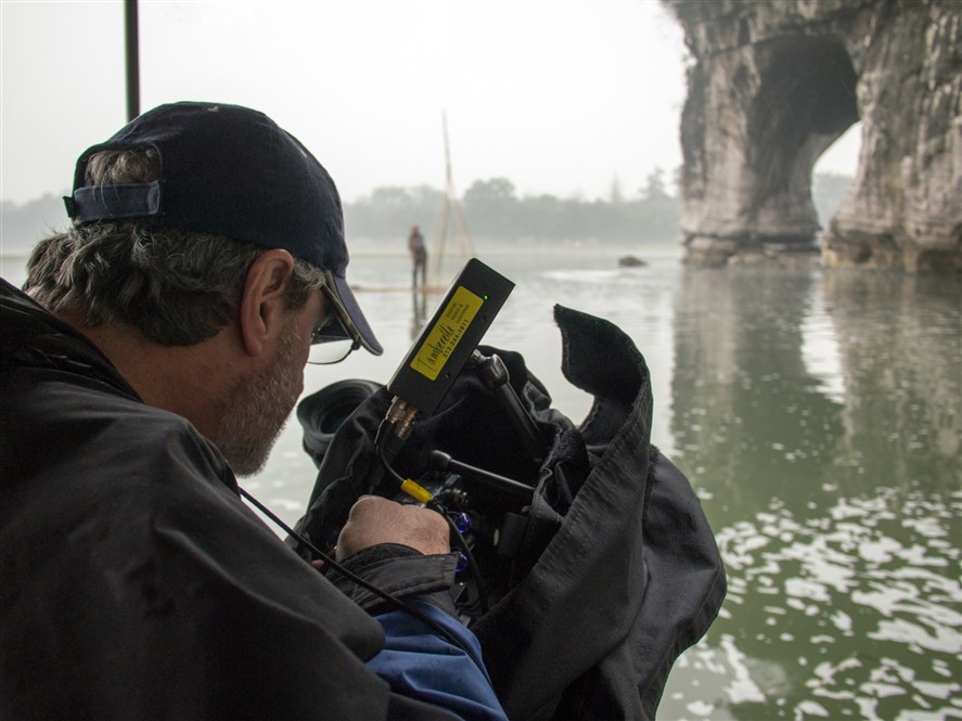 Chengdu production crew reviewing a shoot on location
